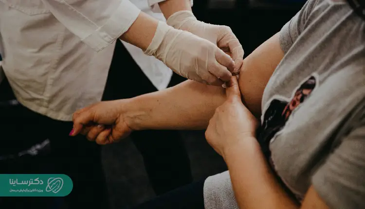 A nurse drawing blood from a patient's arm for an MCH test, which helps assess hemoglobin concentration in red blood cells