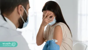 A woman scared of getting an injection, covering her face in fear – Hemophobia fear of blood