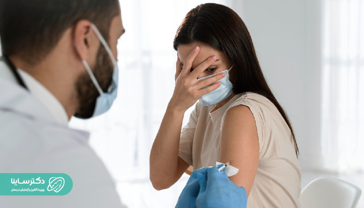 A woman scared of getting an injection, covering her face in fear – Hemophobia fear of blood
