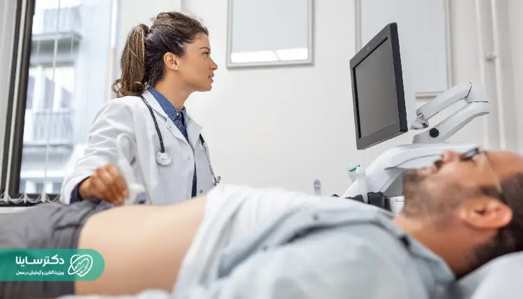 alt="Doctor performing abdominal ultrasound scan on a male patient - What is ultrasound imaging in gastrointestinal health?
