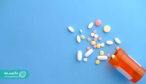 Mixed pills and tablets spread out from an orange prescription bottle. Pills for Prostate Treatment.